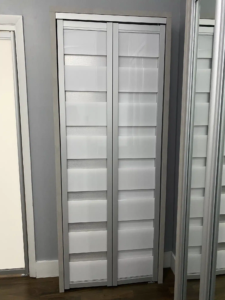 ACBF-07 – AC Bifold Door – White Acrylic – Silver Frame – Silver Backing