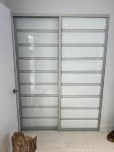 ACSD- 05- AC Two Panels Sliding Door – White Glass – Silver Frame.